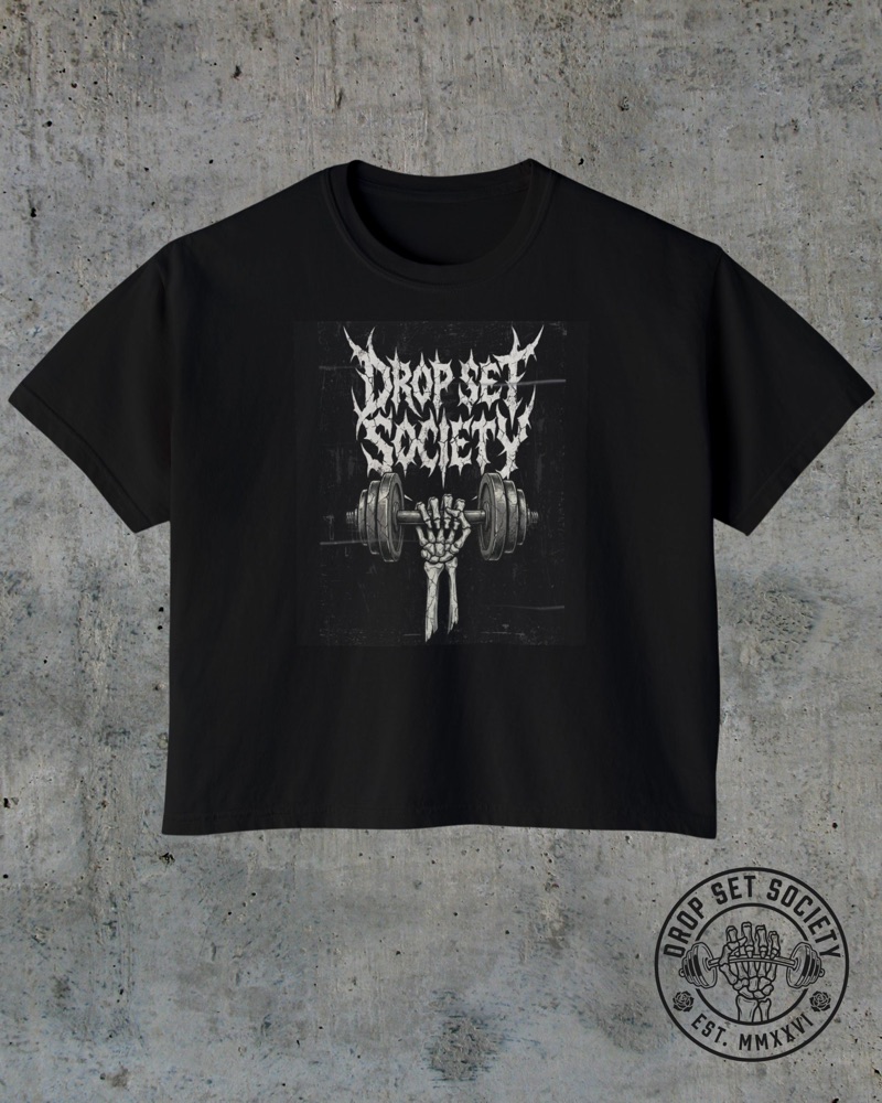 The Rep Tour Boxy Crop tee, black, laid flat on cement